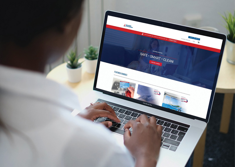 person working on a laptop computer at the BoatUS website