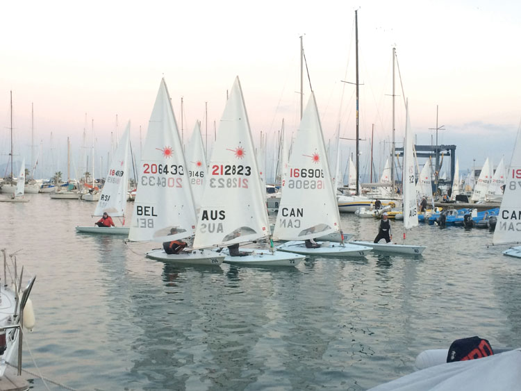Laser full rigs sailed a long way away from the harbor, so they often got back just as the sun was setting.