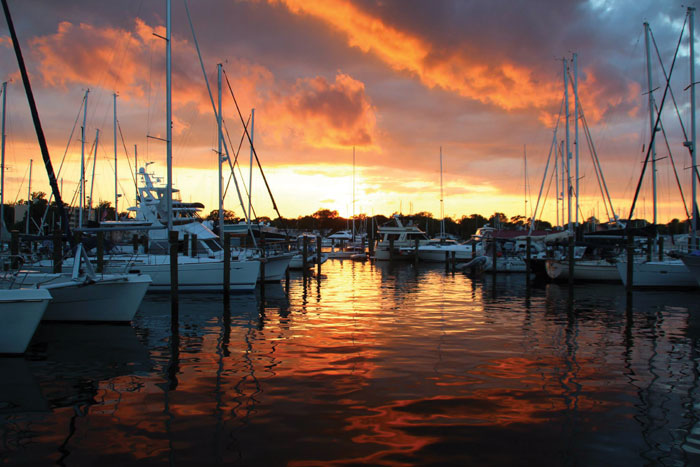 You might fall in love with the sunset view, but before you sign up for a pretty marina, make sure you talk to current slipholders about the level of customer service. Photo by Cindy Wallach