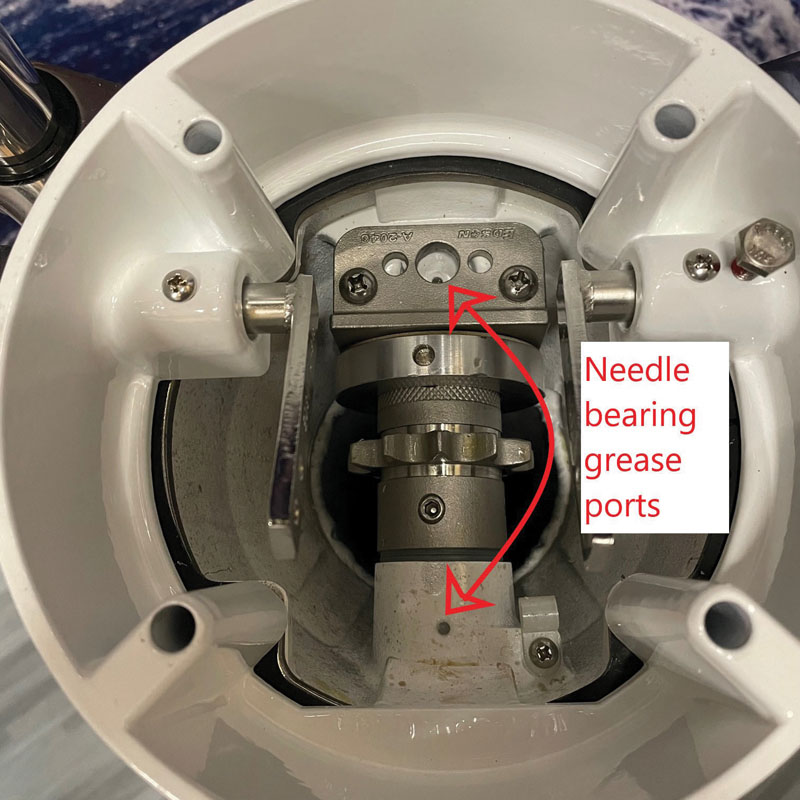 needle bearing grease ports for steering system maintenance