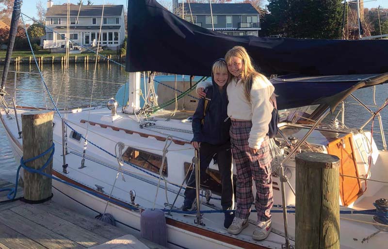 children and docked sailboat