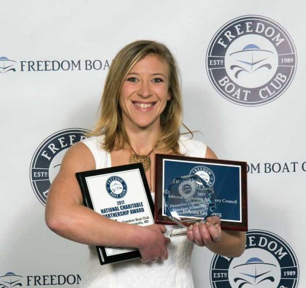 JoAnna Goldberg proudly accepts three major awards at the recent Freedom Boat Club National Franchise Conference. 