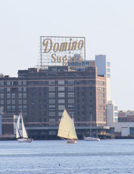 Sailing underneath the iconic Domino's Sugar plant