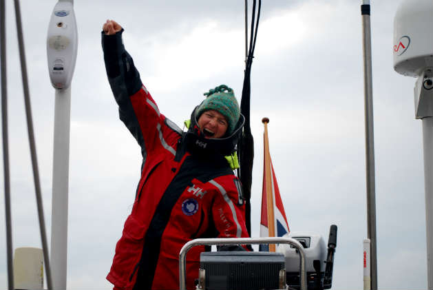 Amanda Saville at the helm of a Swan 57 having just completed a 3 year voyage from Norway to Antarctica, and return