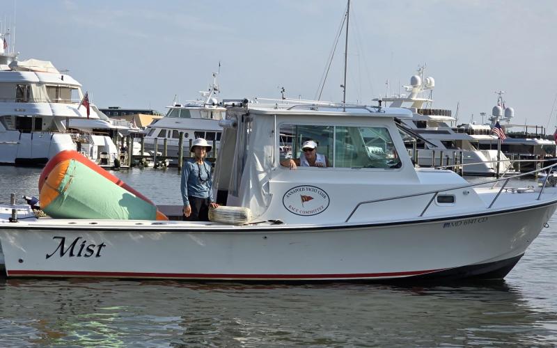The mark boat waiting to tow some Sonars out to the race course