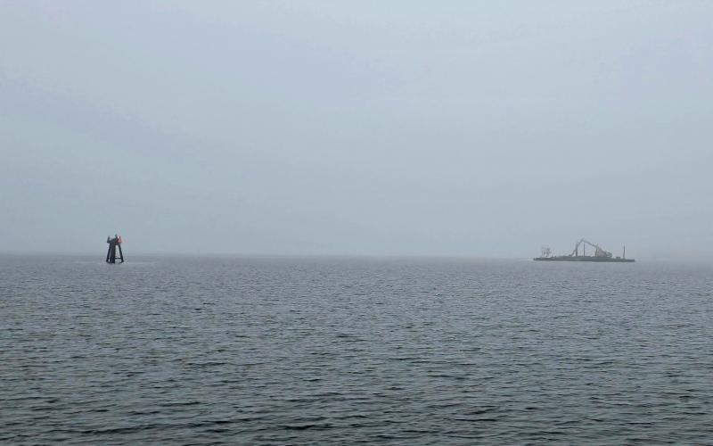 A barge making her way up the South River in intense fog....
