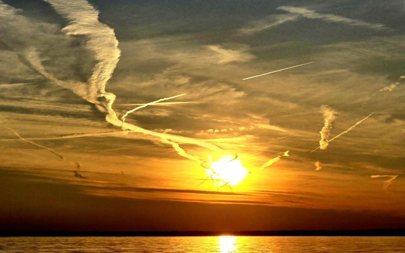 Pretty sunset, and great cloud wisps creating an interesting effect arond the setting sun