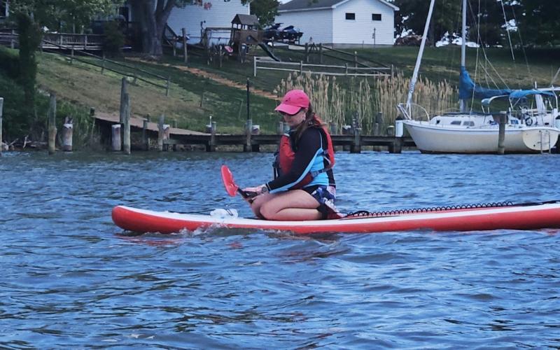 Michelle on her paddle board, with the wind it was too hard to stand so she mostly stayed on her knees.