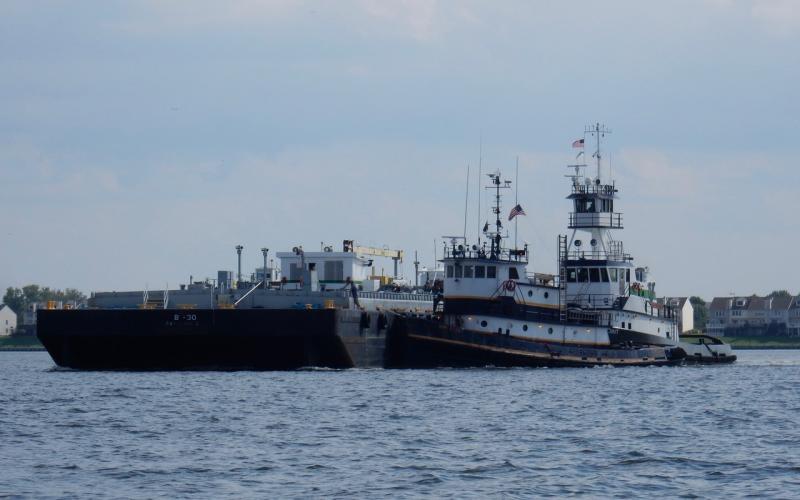 Tugboats Sun Coast and Kings Point with fuel barge B-30