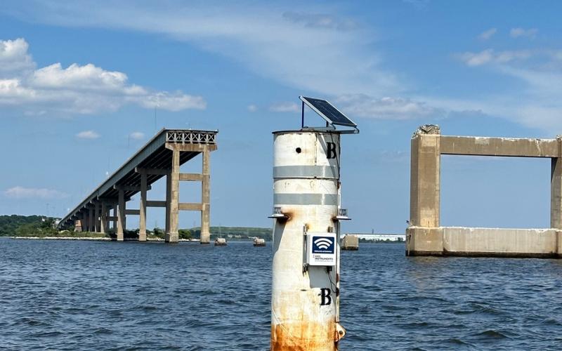 Buoy marking the northern small boat channel through the Key Bridge remains