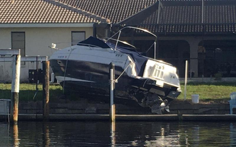 Powerboat blown from her boat lift by Hurricane Milton last year
