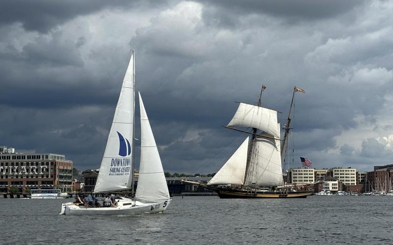 J22 from the Downtown Sailing Center sailing by the Pride of Baltimore II