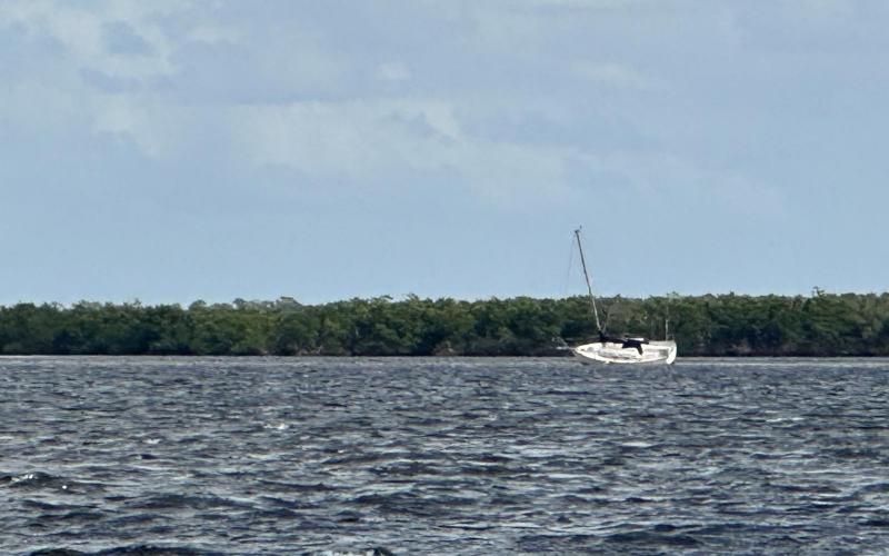 Sailboat aground and listing south of Alligator Creek