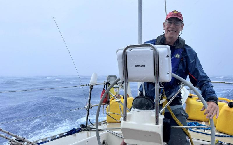 Tom Shaw in a squall north of Bermuda by Bill Carruth