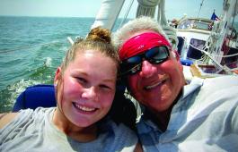 Capt. Aram and Amelia take a selfie while sailing out of Solomons aboard Heron.  					