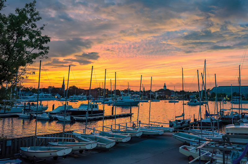 Sunset with a sailboat boatyard in the foreground