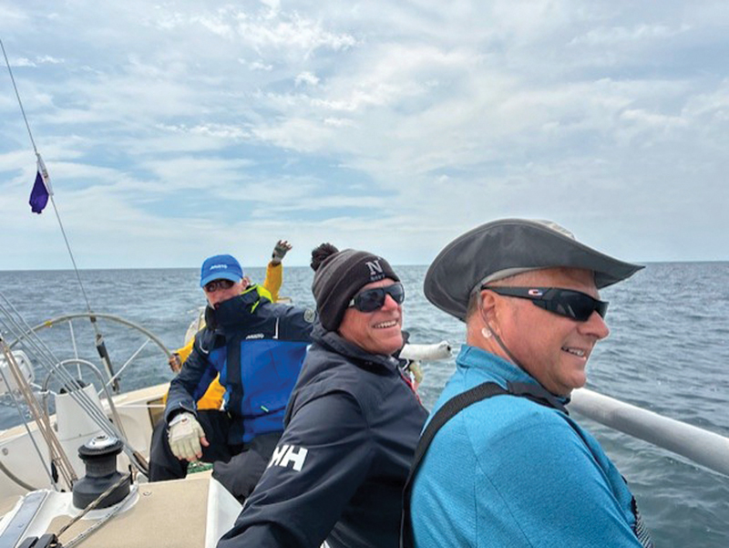 Kalisch, Gibson, and Riley at the 2025 Chicago Mac. Chicago to Mackinac 2025, sailors on the rail.