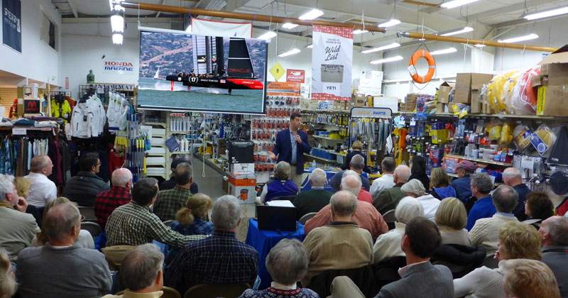 Tucker Thompson speaks in front of a crowd at Fawcett Boat Supplies in Annapolis. Photo by Craig Ligibel