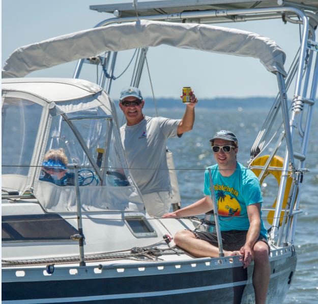 Sailors waving. Photo by Al Schreitmueller.