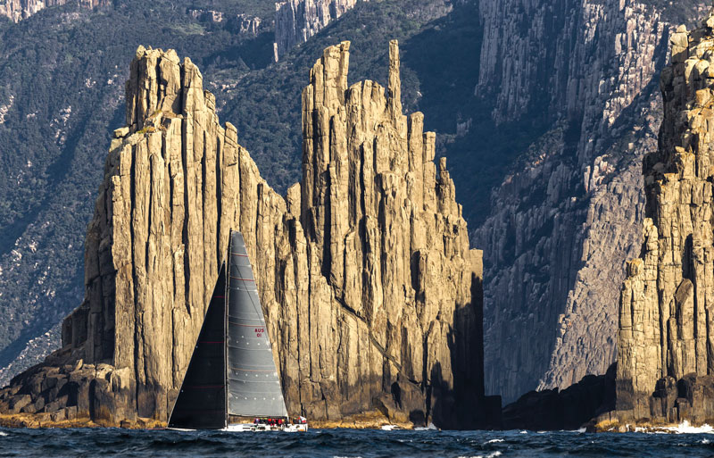 2015 Rolex competitor Ichiban sails down the Tasmanian Coast past a spectacular feature called the Organ Pipes. Photo by Stefano Gattini