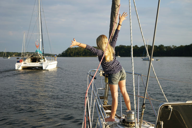 The crew of Totem says goodbye to the author's boat, Majestic. Photo by Behan Gifford