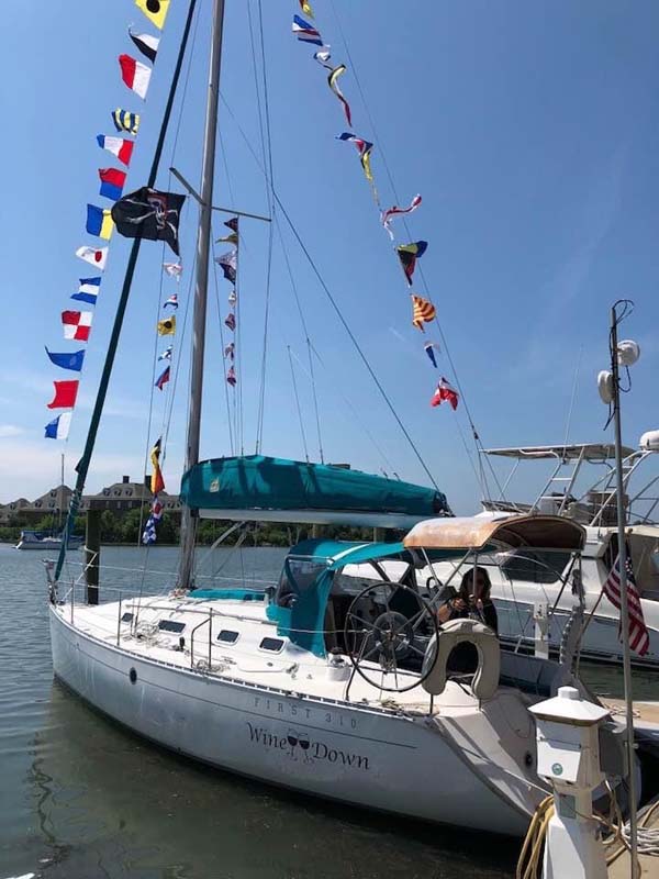 Sailing vessel Wine Down with flags